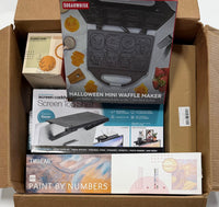 Northeast Liquidation overstock box with waffle maker, candle, and assorted new-condition home goods